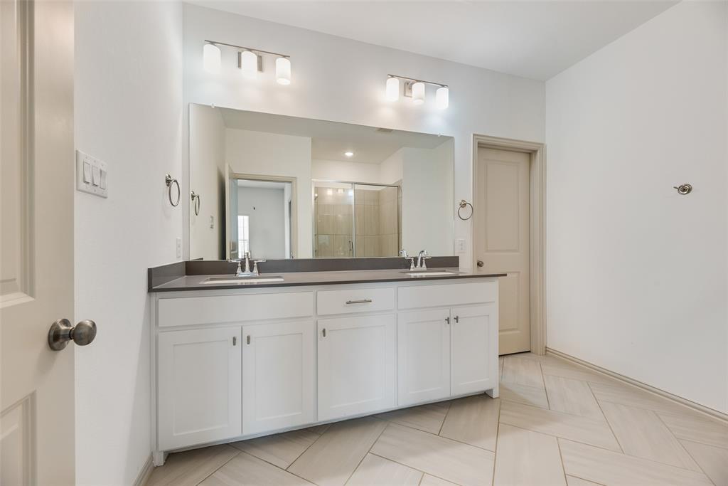 9005 Phoebe Road Frisco, TX 75035 - Photo 19 of 23 a spacious bathroom with a granite countertop sink a mirror and a