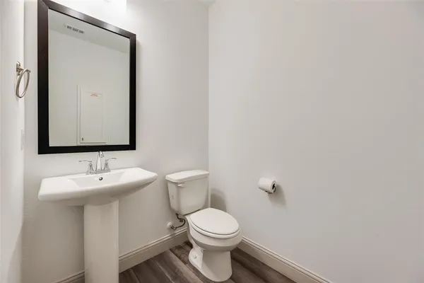 a bathroom with a glass shower door