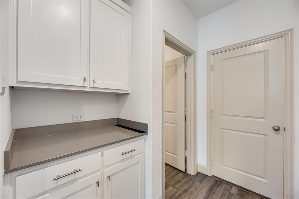 9005 Phoebe Road Frisco, TX 75035 - Photo 22 of 23 a view of cabinets and wooden floor