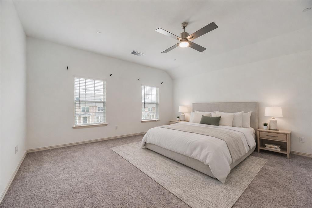 9005 Phoebe Road Frisco, TX 75035 - Photo 9 of 23 a bedroom with a large bed and a chandelier