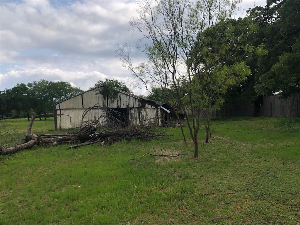 15411 Seagoville Road Dallas, TX 75253 - Photo 4 of 10 a view of a house with a yard