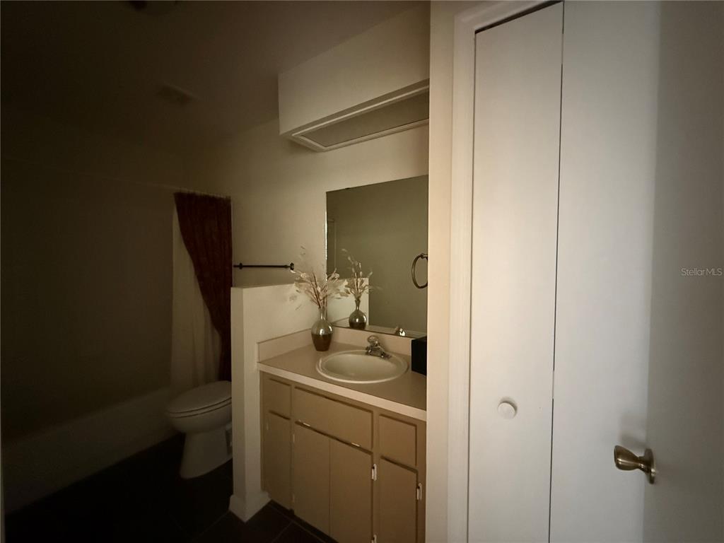 5510 Shriver Street Leesburg, FL 34748 - Photo 11 of 16 a bathroom with a sink toilet and vanity