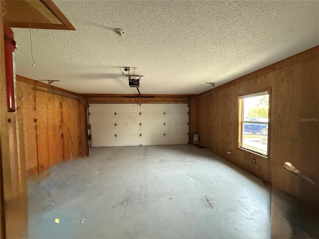 5510 Shriver Street Leesburg, FL 34748 - Photo 15 of 16 a view of a room with window and cabinet in it