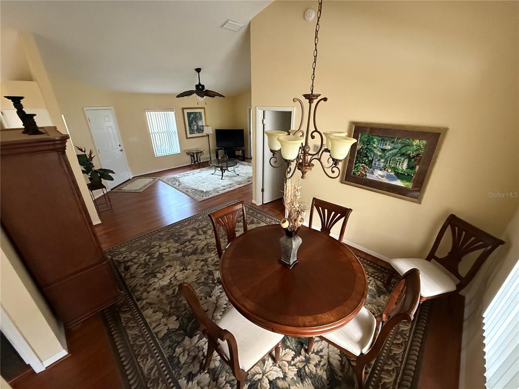 5510 Shriver Street Leesburg, FL 34748 - Photo 5 of 16 a living room with furniture and a wooden floor