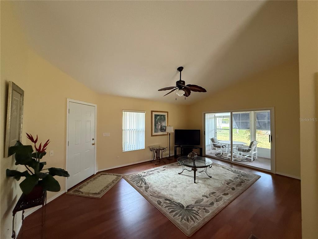 5510 Shriver Street Leesburg, FL 34748 - Photo 6 of 16 a view of a livingroom with furniture and wooden floor