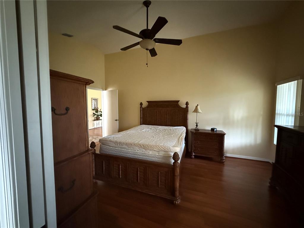 5510 Shriver Street Leesburg, FL 34748 - Photo 10 of 16 a bedroom with a bed and a tv on table
