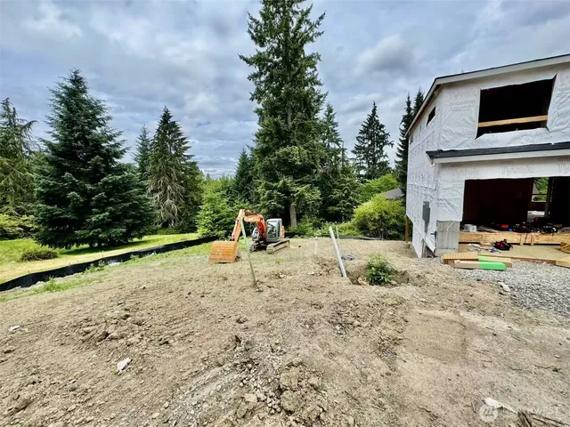 a view of a backyard of a house