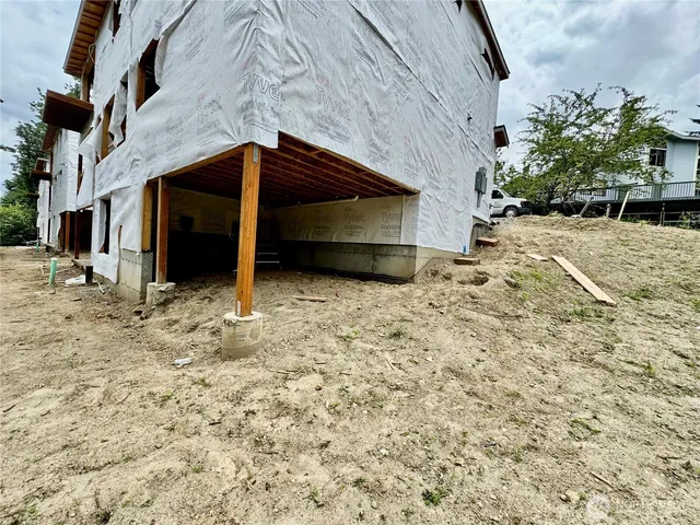 a view of yard with swimming pool outdoor seating and plants