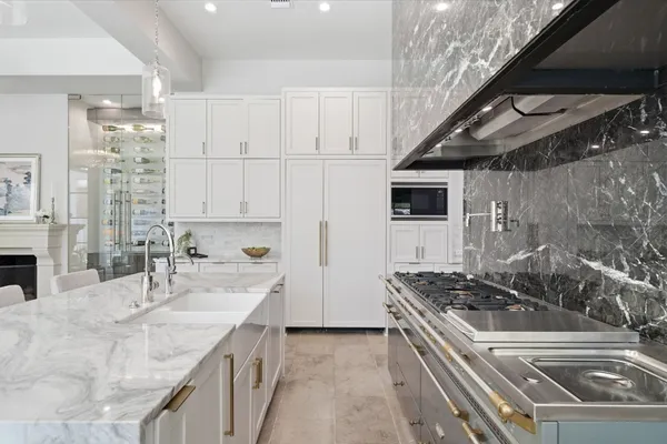 a kitchen that has a sink and a stove