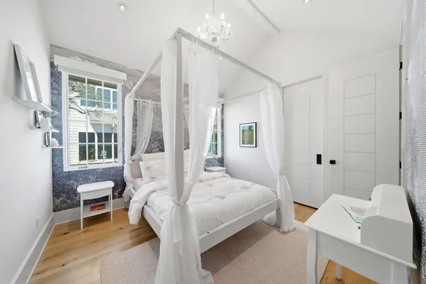 a bedroom with a bed and a table