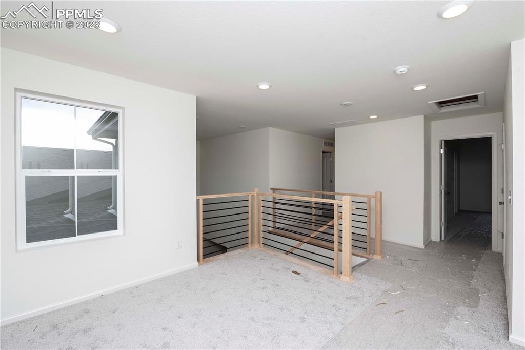 644 Felicity Loop Castle Rock, CO 80109 - Photo 15 of 23 wooden floor in an empty room with a window