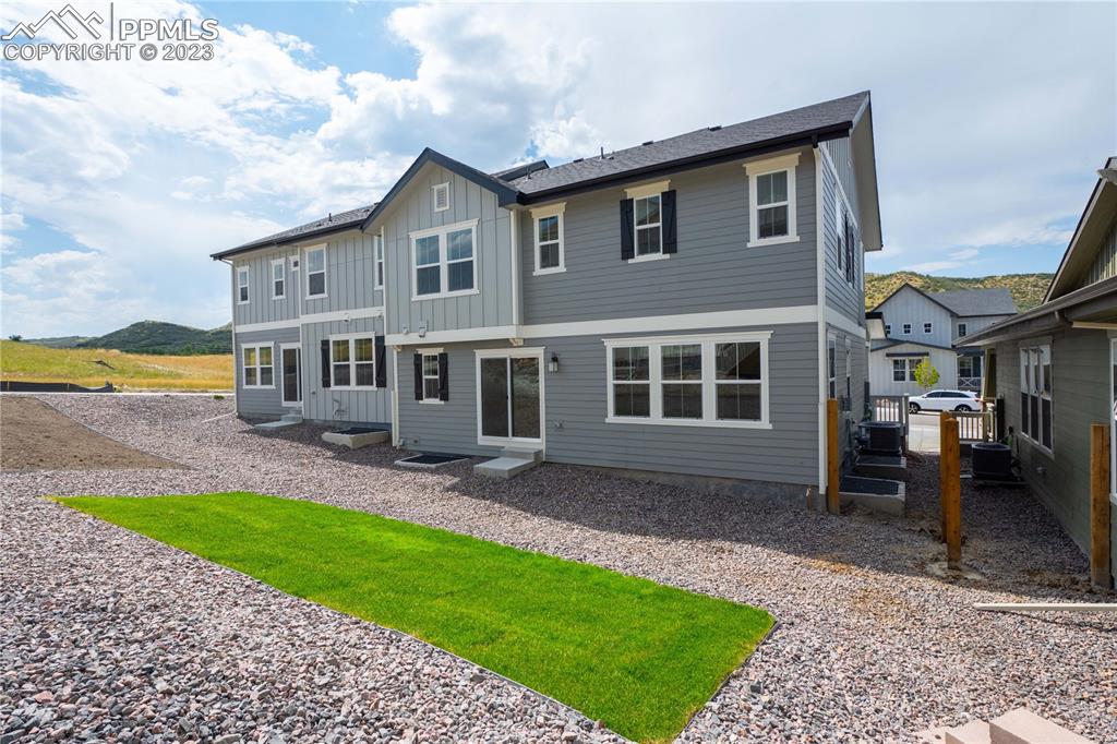 644 Felicity Loop Castle Rock, CO 80109 - Photo 22 of 23 a front view of a house with a yard and garage