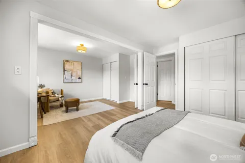 a bedroom with a bed and a couch