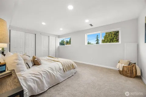 a bed room with a bed and a painting