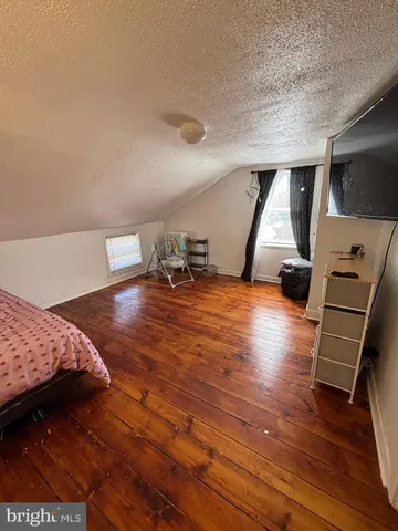 a view of room with wooden floor and equipment
