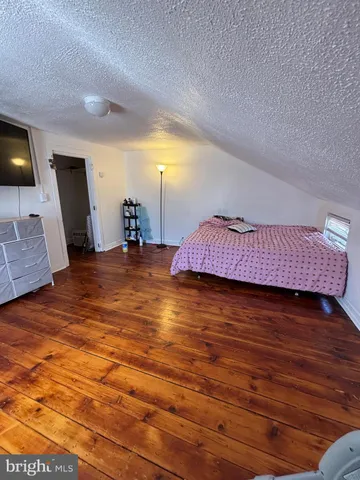 a view of living room with furniture and flat screen tv