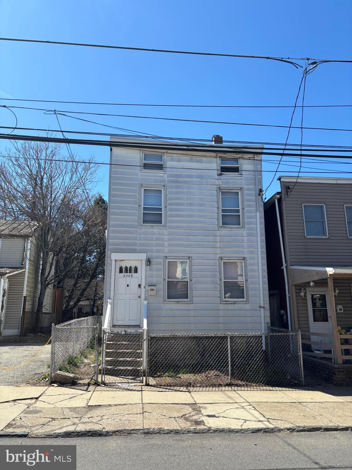4448 Mitchell Street Philadelphia, PA 19128 - Photo 2 of 22 a front view of a house with garage