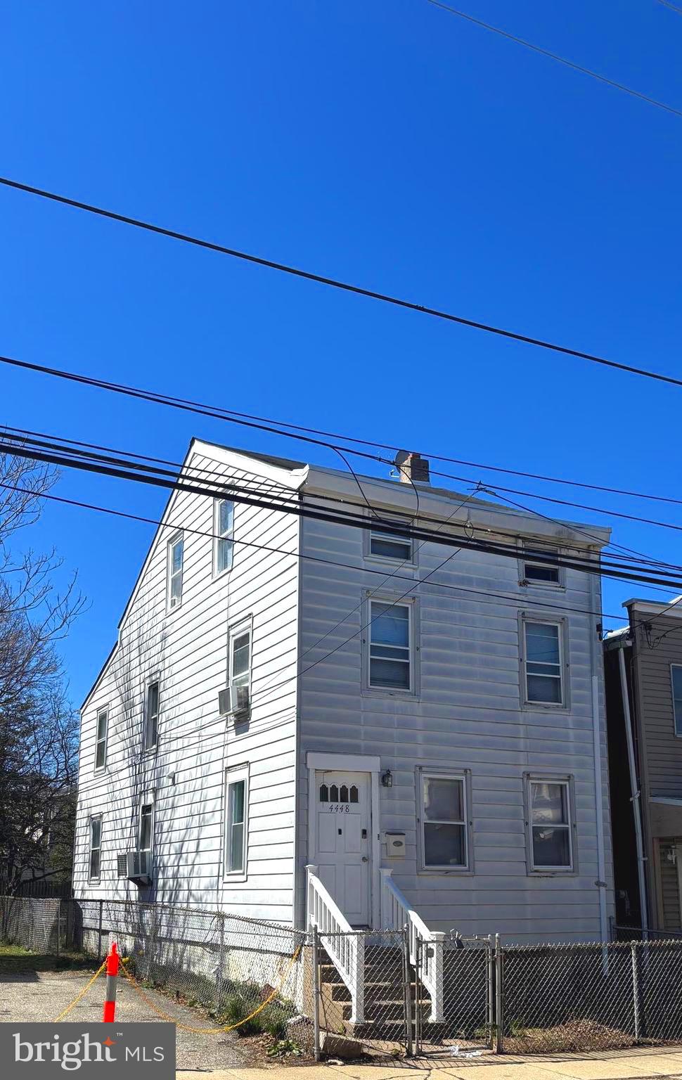 4448 Mitchell Street Philadelphia, PA 19128 - Photo 3 of 22 a view of a house with large windows