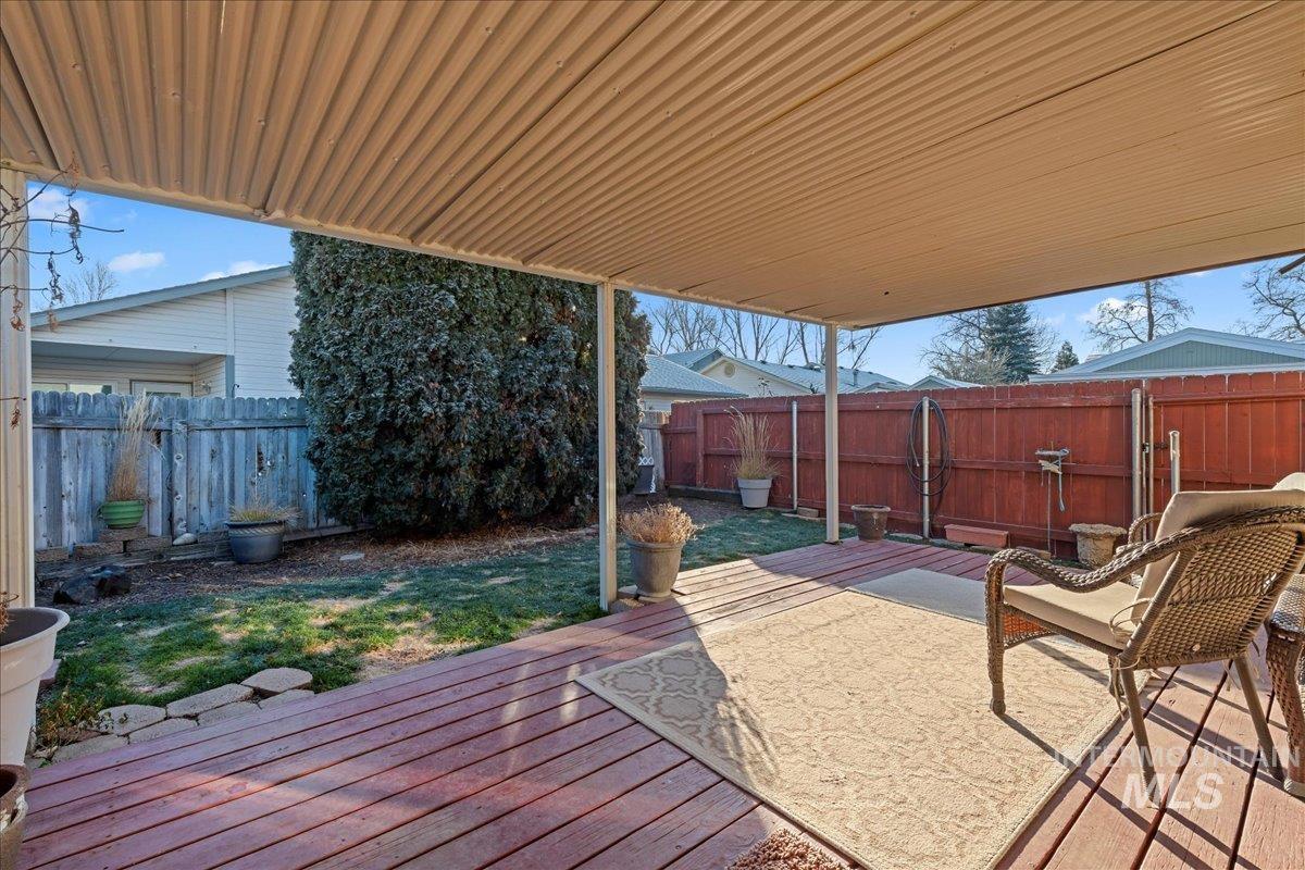 4747 Albion Street, Unit J Boise, ID 83705 - Photo 18 of 21 Wooden terrace featuring a fenced backyard