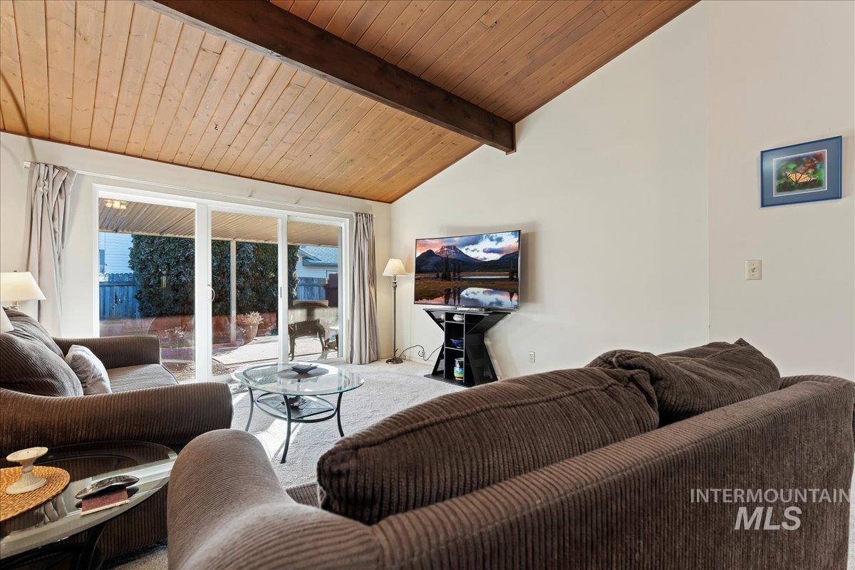 4747 Albion Street, Unit J Boise, ID 83705 - Photo 7 of 21 Living room featuring carpet floors and wooden ceiling