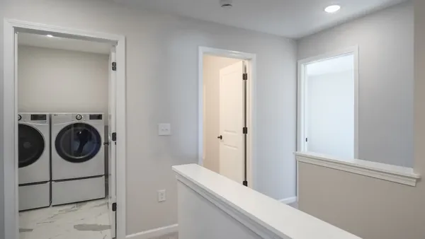 a view of an entryway with wooden floor