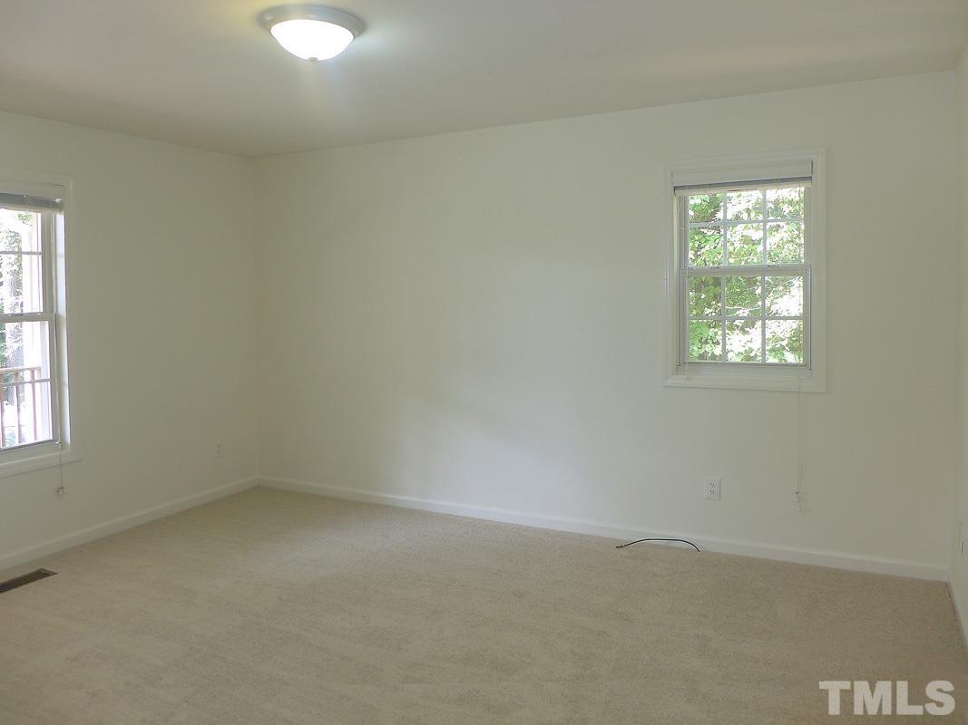 400 B W Poplar Avenue Carrboro, NC 27510 - Photo 11 of 20 an empty room with windows