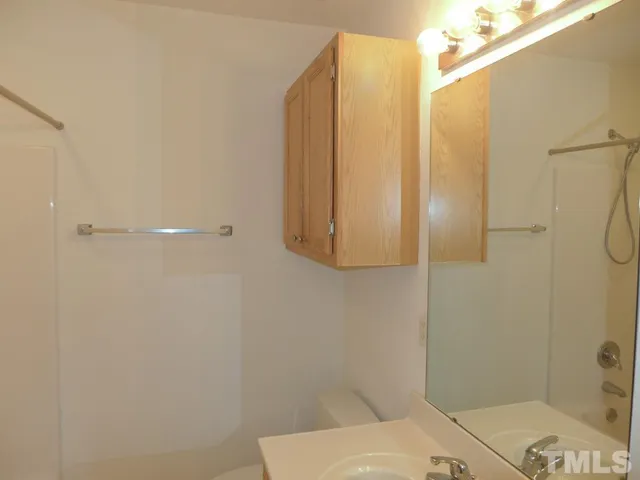 a bathroom with a sink and shower