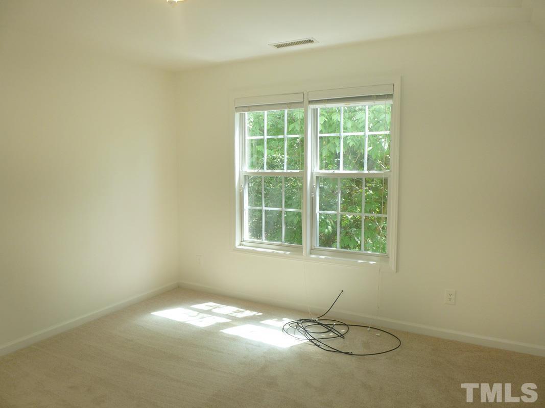 400 B W Poplar Avenue Carrboro, NC 27510 - Photo 14 of 20 a view of an empty room with a window