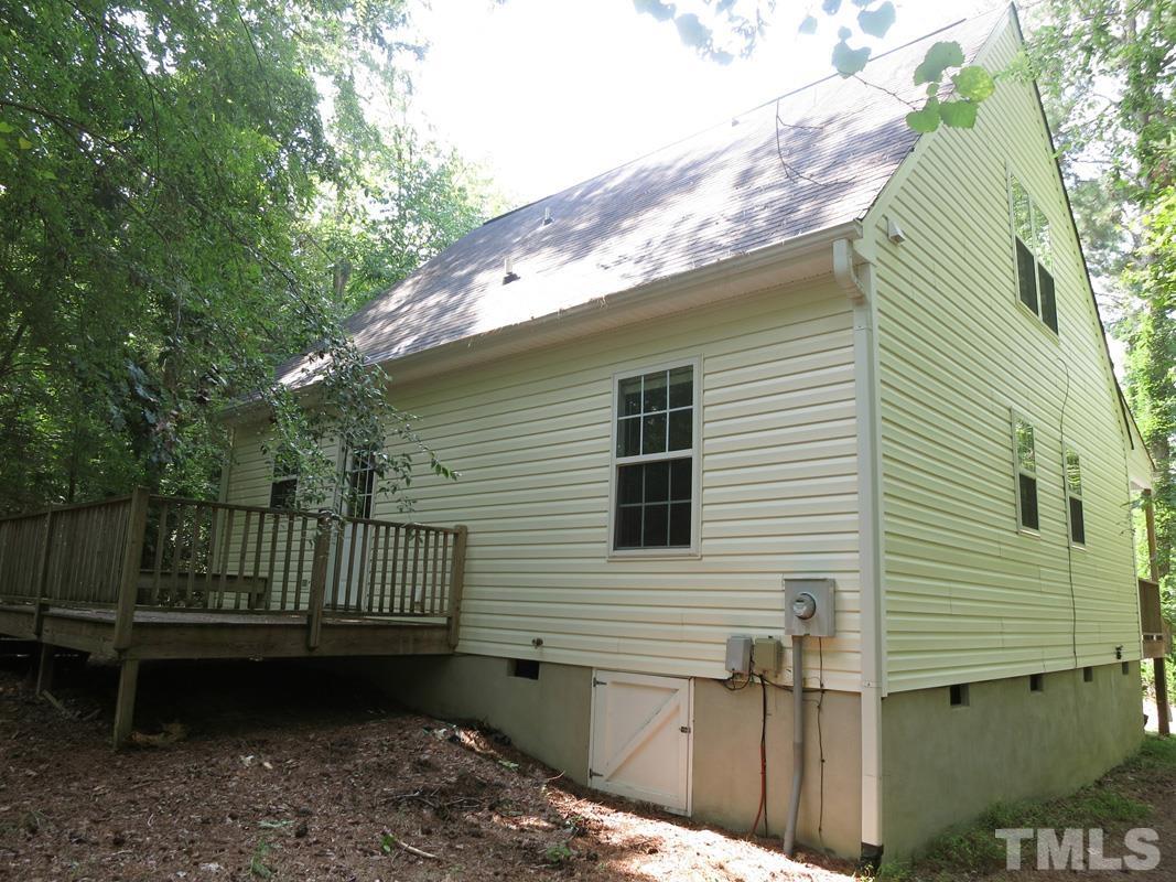 400 B W Poplar Avenue Carrboro, NC 27510 - Photo 18 of 20 a view of a house with a wooden deck and a backyard