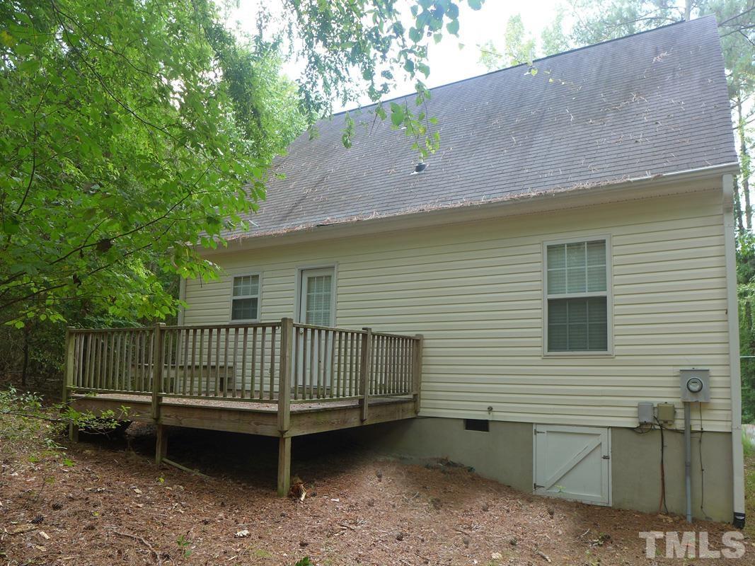 400 B W Poplar Avenue Carrboro, NC 27510 - Photo 19 of 20 a view of a yard with a bench and wooden fence