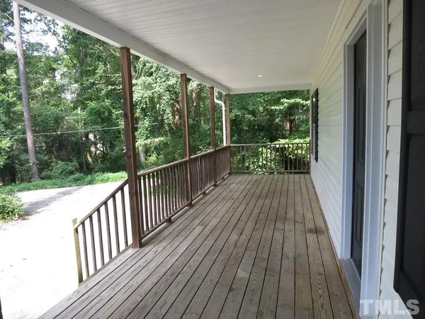 a view of balcony with wooden floor