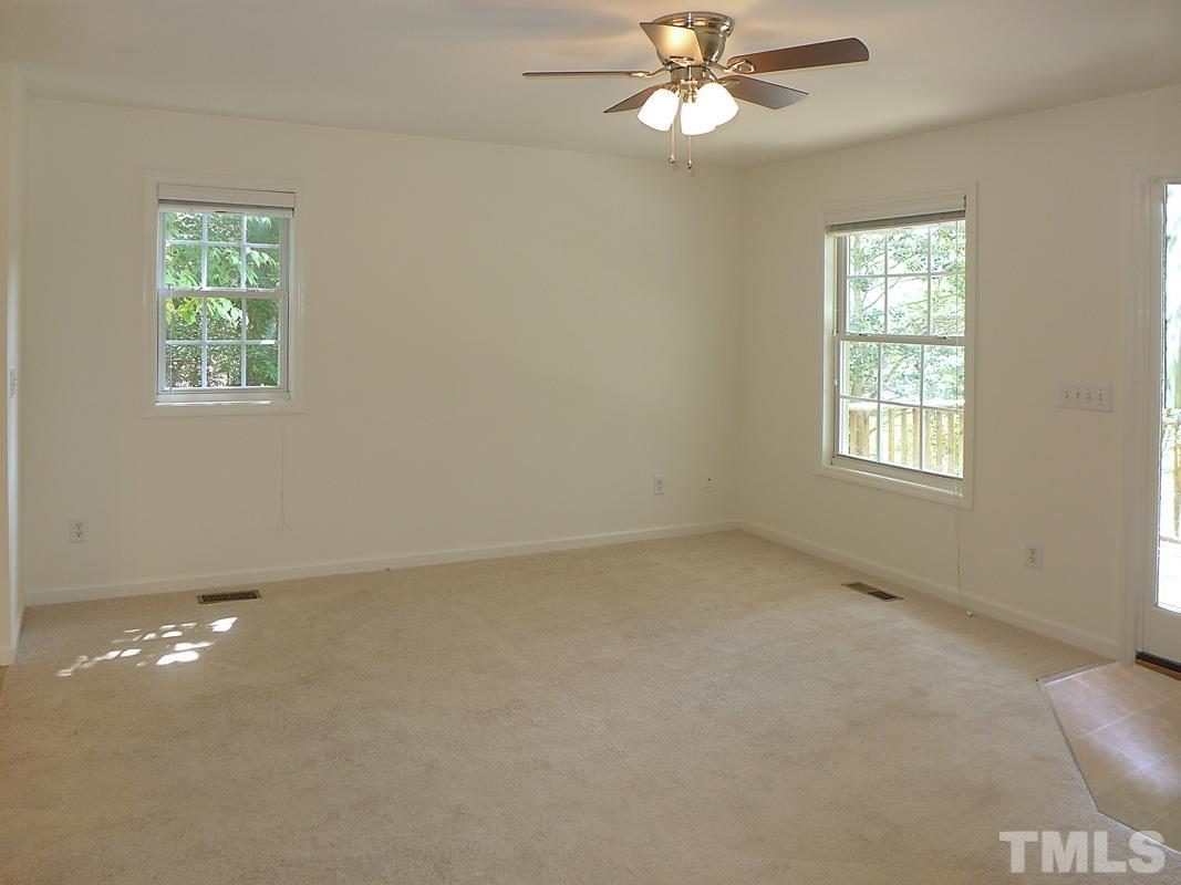 400 B W Poplar Avenue Carrboro, NC 27510 - Photo 6 of 20 an empty room with windows and fan