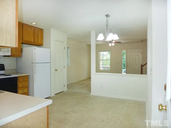 a view of a kitchen with a refrigerator a sink and dishwasher