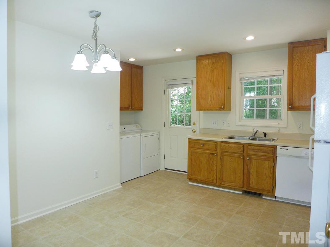 400 B W Poplar Avenue Carrboro, NC 27510 - Photo 9 of 20 a kitchen with sink cabinets and window