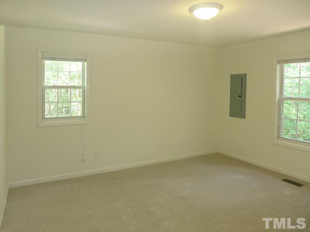 400 B W Poplar Avenue Carrboro, NC 27510 - Photo 10 of 20 an empty room with a window