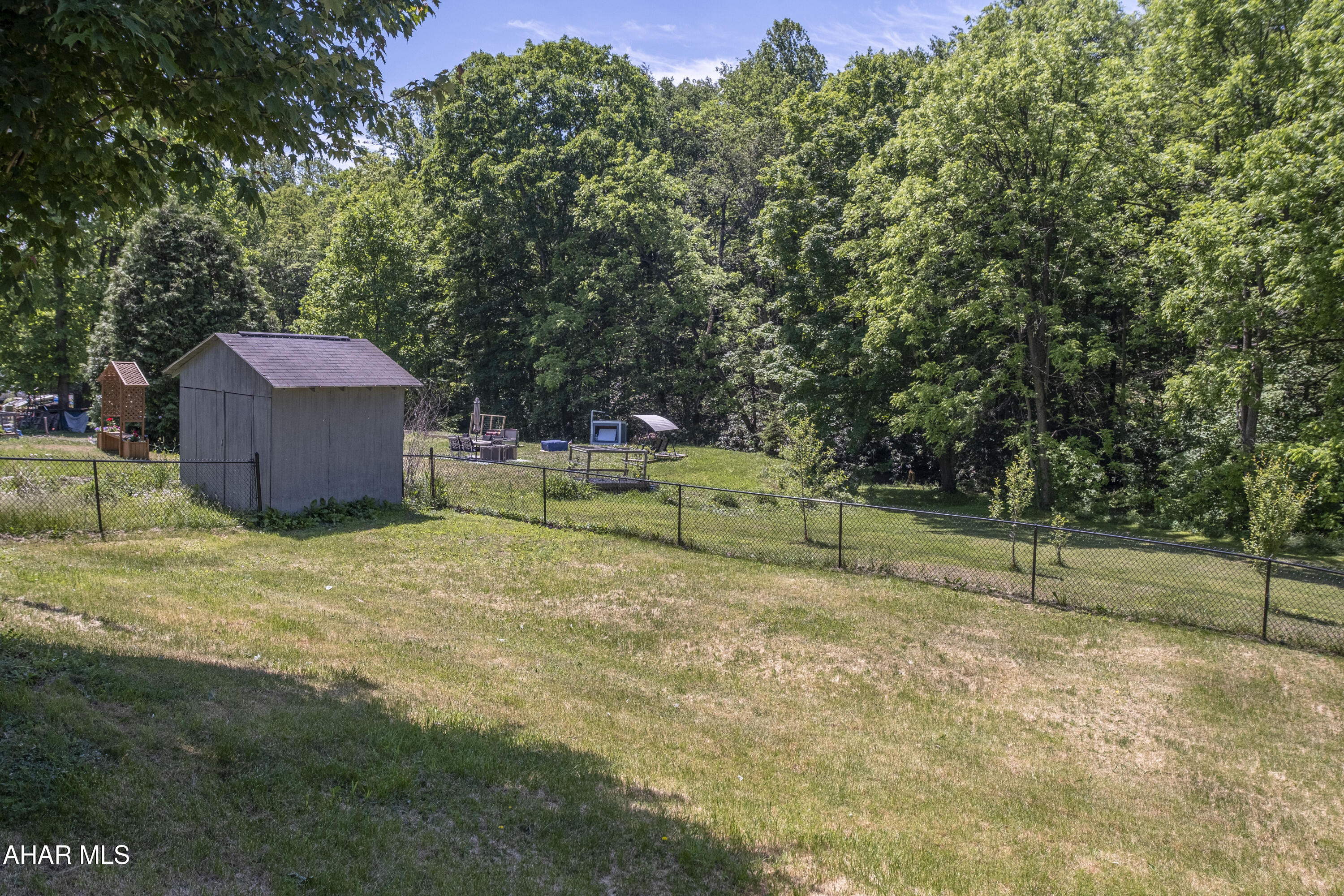 871 Decker Hollow Road Tyrone, PA 16686 - Photo 2 of 35 a backyard of a house with table and chairs