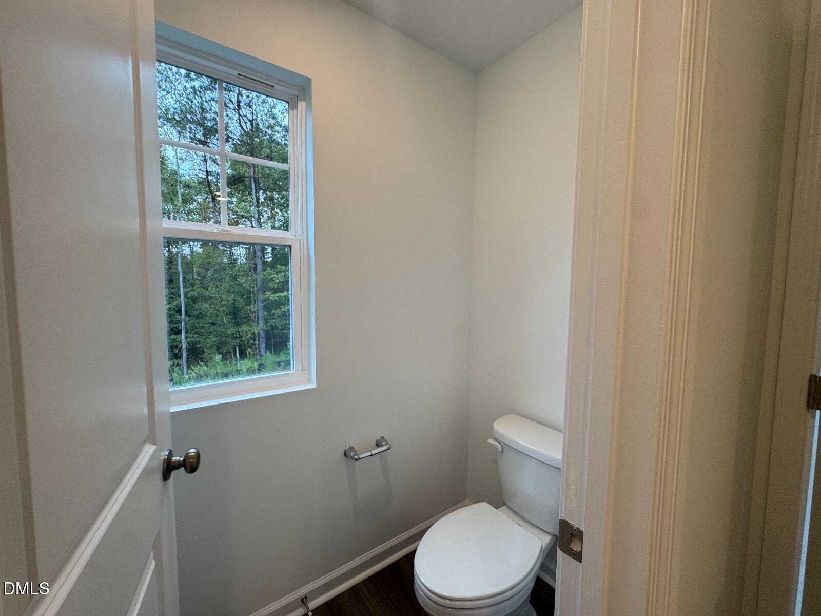229 Lily Patch Lane Smithfield, NC 27577 - Photo 13 of 23 a white toilet sitting next to a window