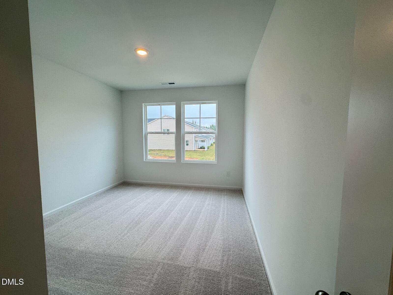 229 Lily Patch Lane Smithfield, NC 27577 - Photo 15 of 23 an empty room with windows