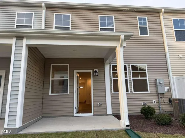 a large kitchen with kitchen island a sink stainless steel appliances and cabinets