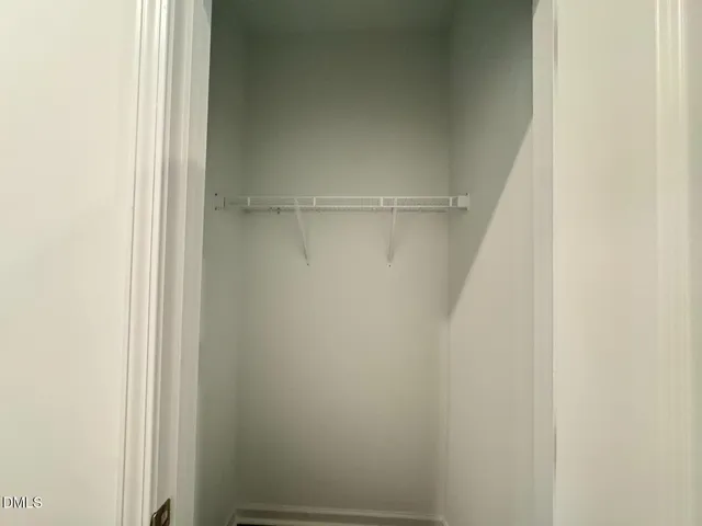 a bathroom with a sink mirror and toilet