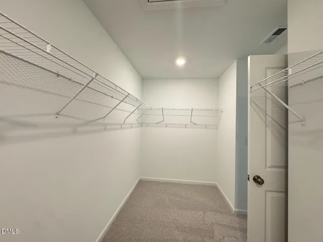 a view of a room with racks on the wall