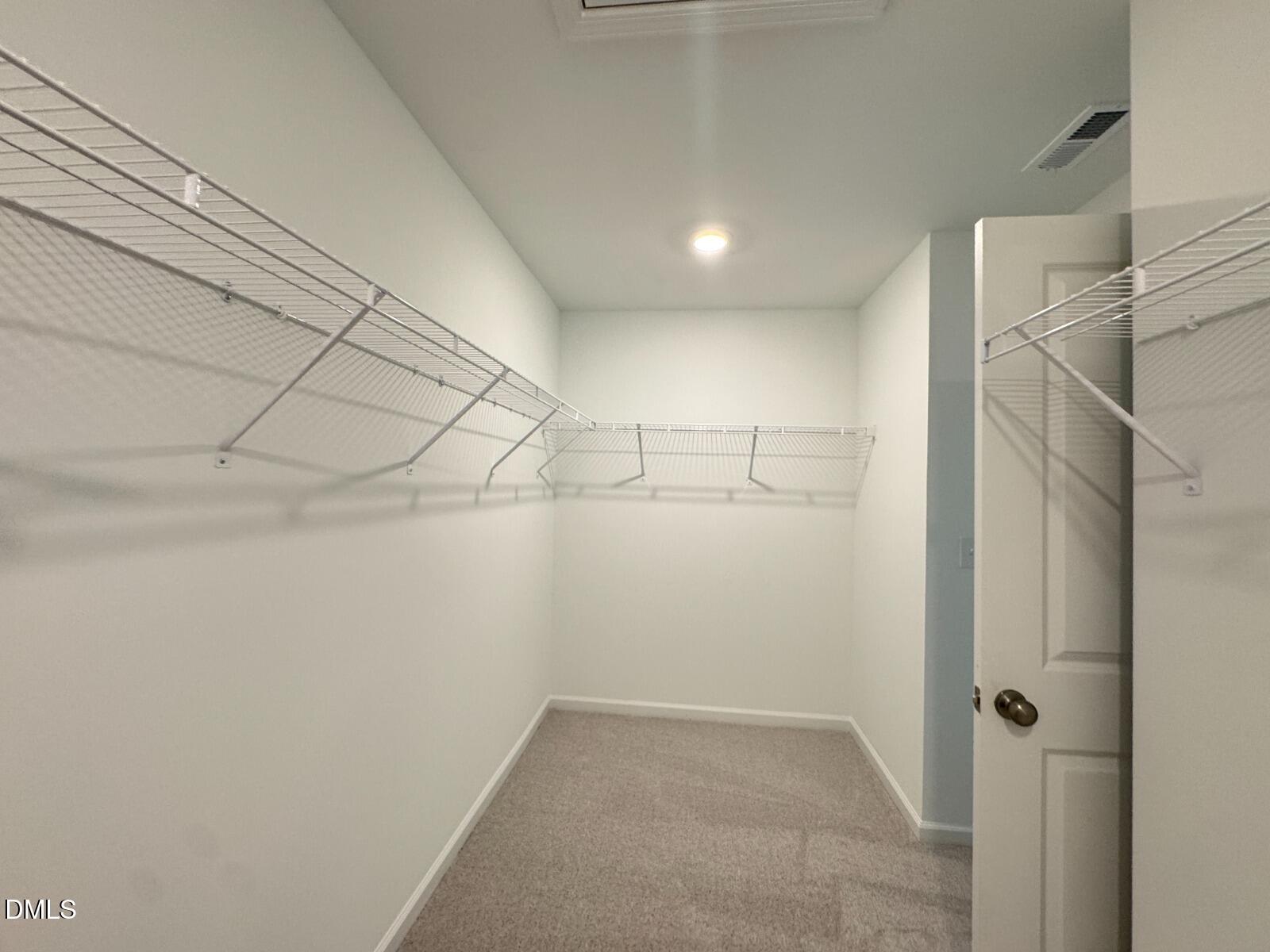 229 Lily Patch Lane Smithfield, NC 27577 - Photo 10 of 23 a view of a room with racks on the wall