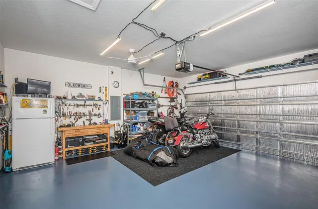 a view of a patio with a dining table chairs and couches with wooden floor
