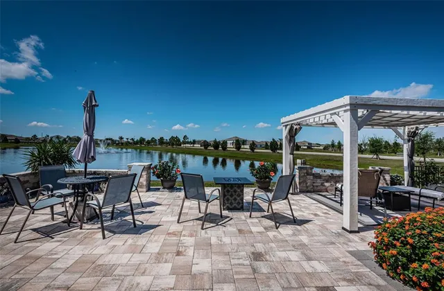 a front view of house with outdoor seating and yard