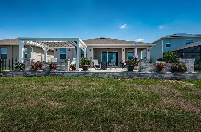 a view of a swimming pool with a patio
