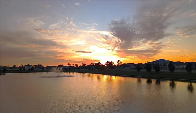 a view of a chairs and table in the garden