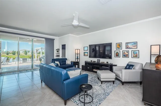 a kitchen with stainless steel appliances a dining table chairs stove and refrigerator