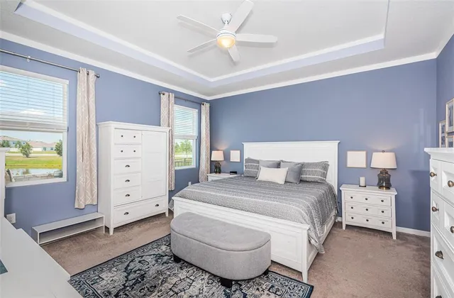 a bedroom with a bed and a flat screen tv in it