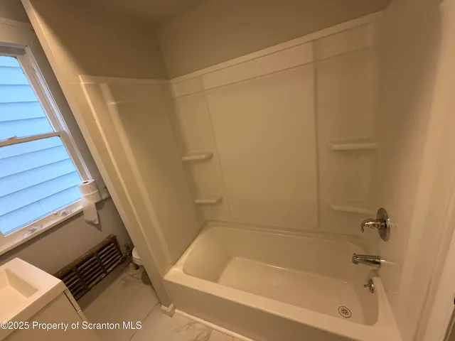 a bathroom with a bathtub