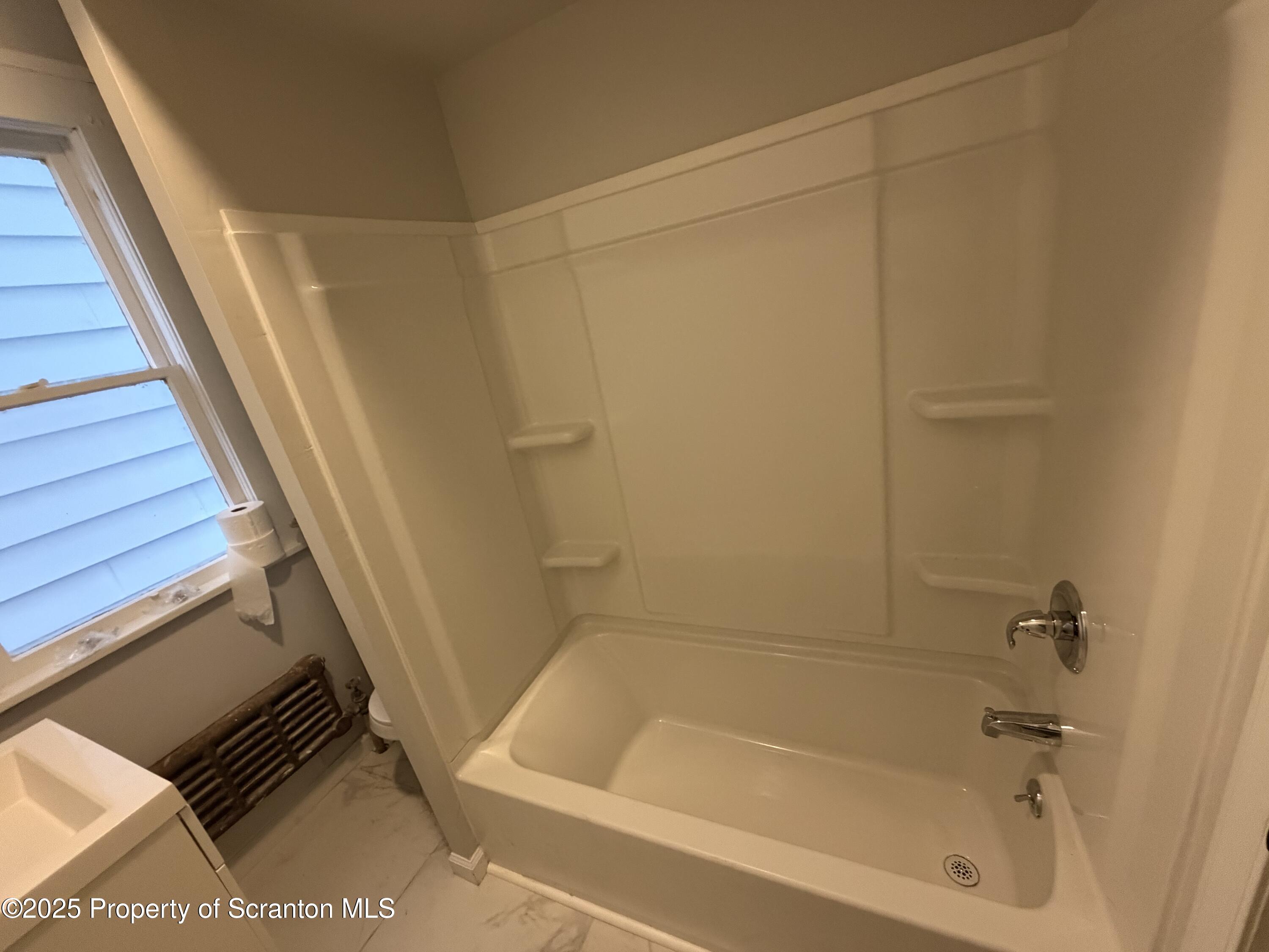 2105 Belmont Terrace, Unit 1 Scranton, PA 18508 - Photo 13 of 16 a bathroom with a bathtub